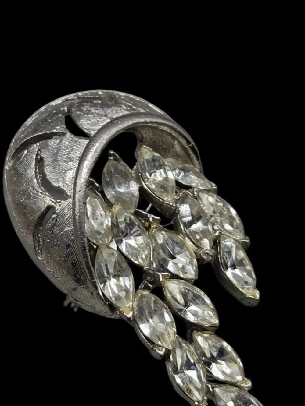 None this brooch